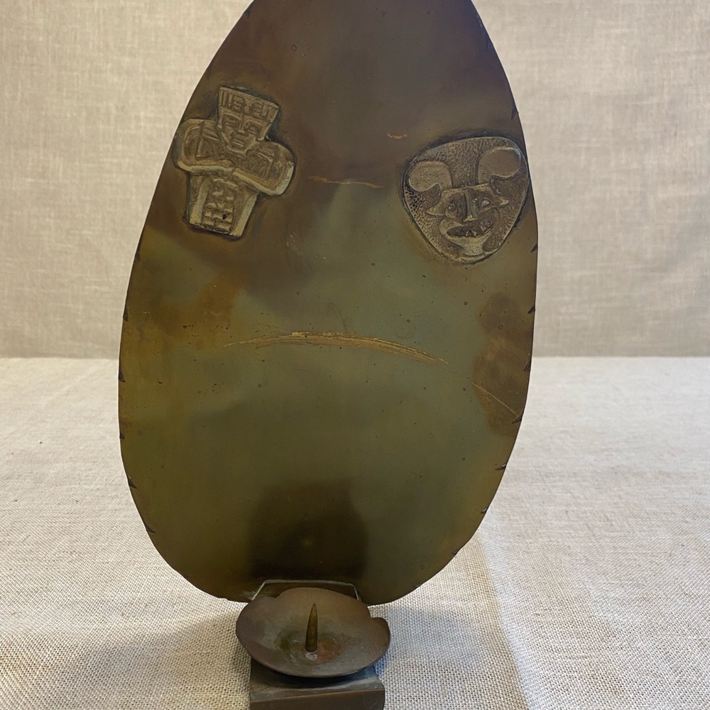 Hand made wall hanging metal candle holder.